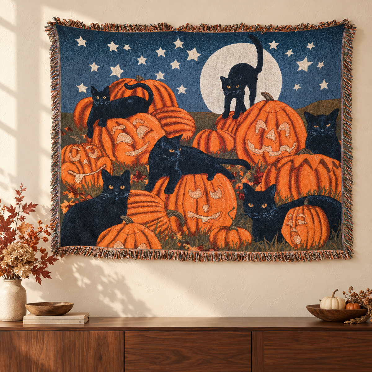 Black cat and pumpkin tapestry displayed above a walnut sideboard